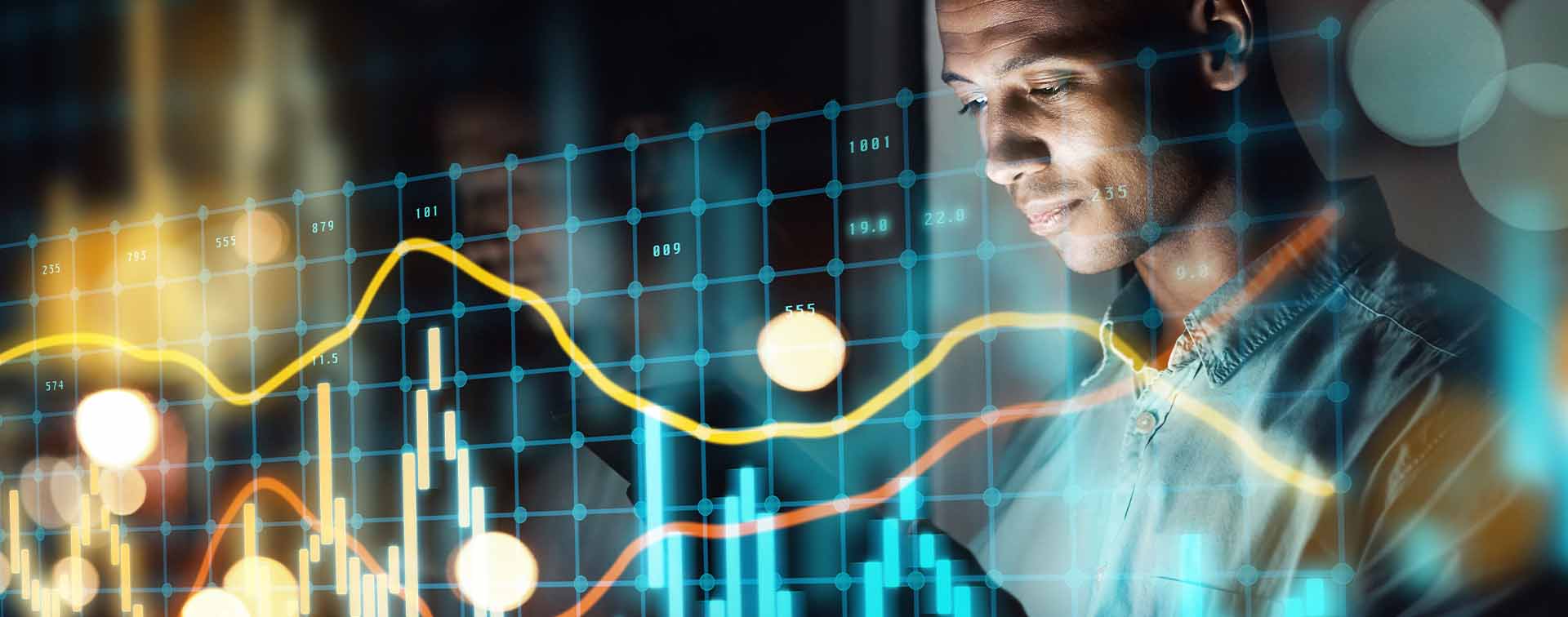 Digital composite of a man working on a tablet and a line graph