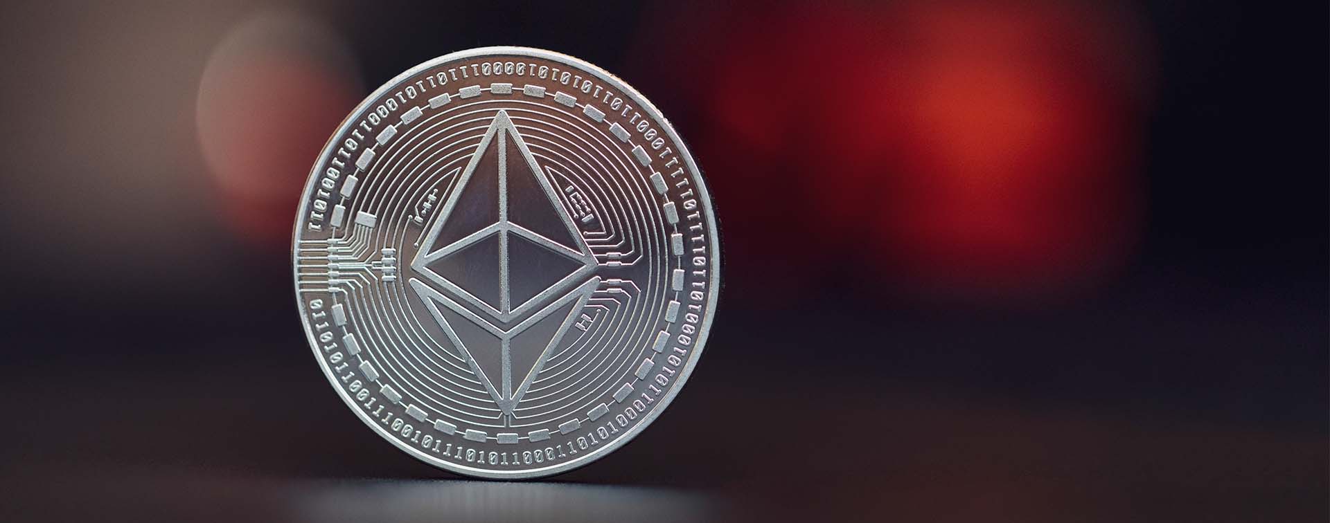Close-up of silver colored Ethereum coin