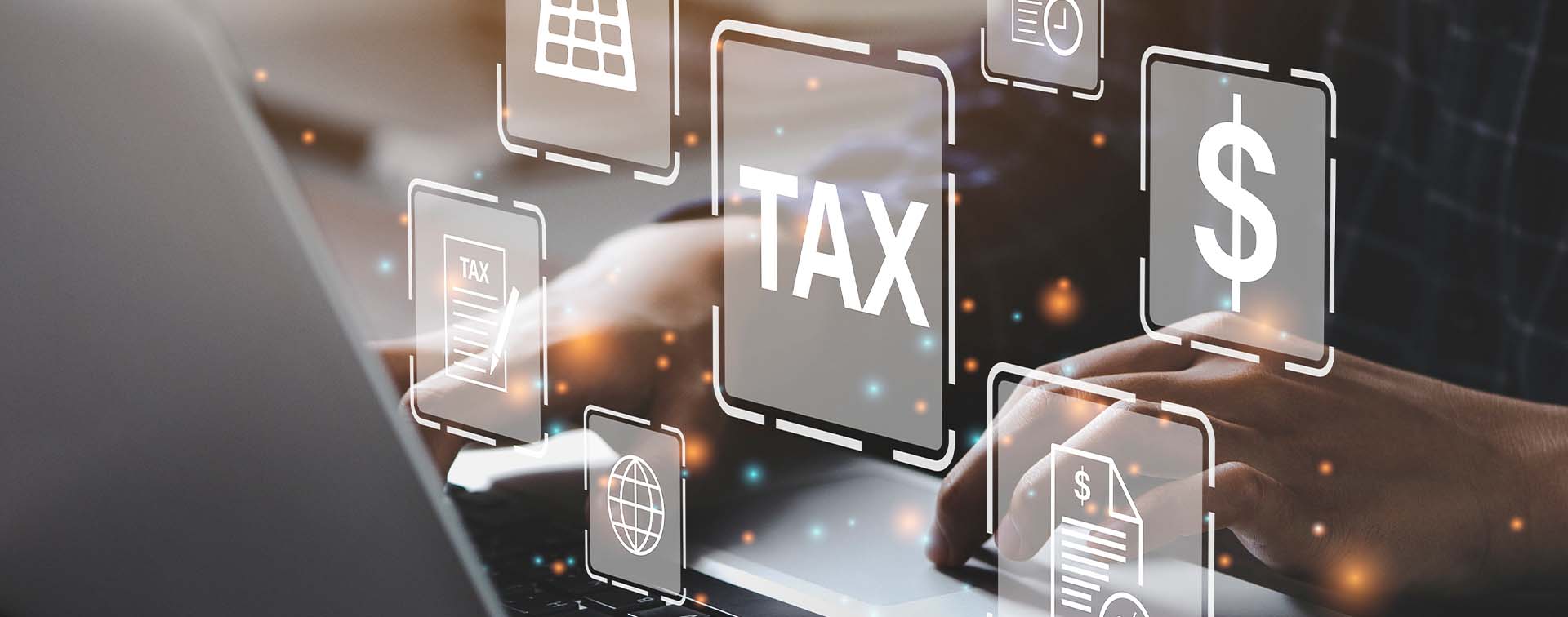 Person filling out tax forms on a laptop