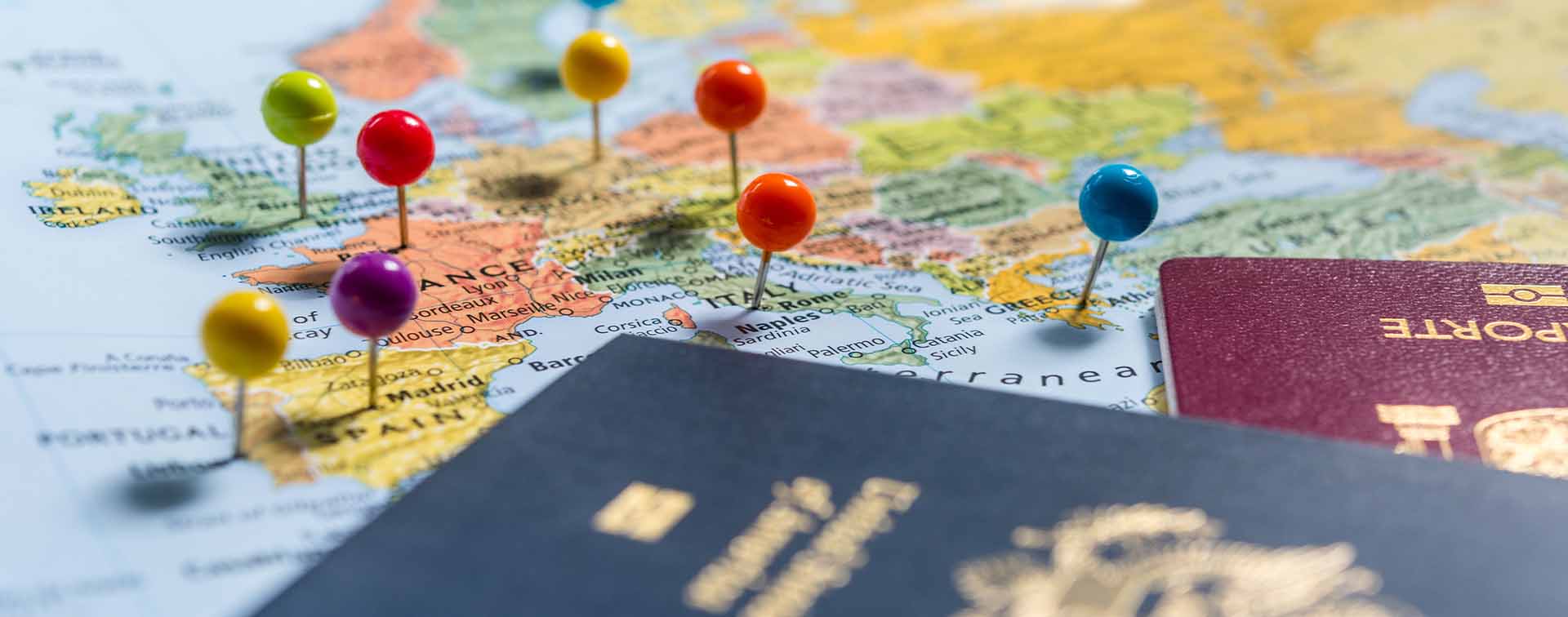Map of Europe with pins in capital cities and two passports