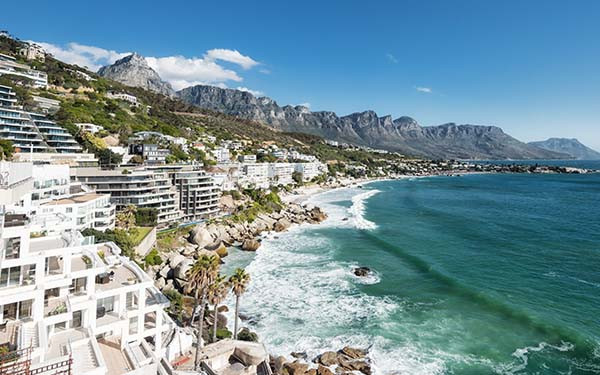Camps Bay Cape Town with Twelve Apostles in the background.