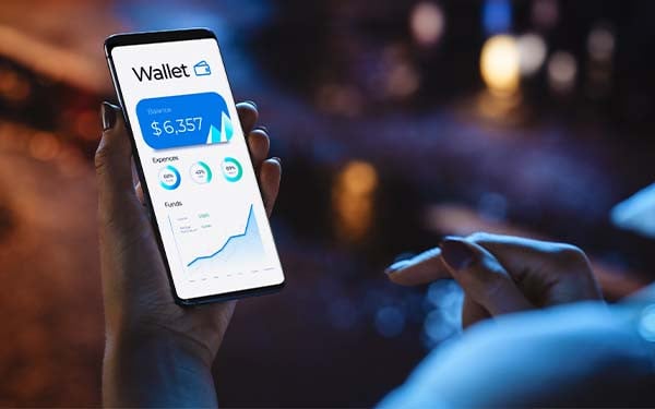 Woman using smartphone to check the balance of an online wallet 