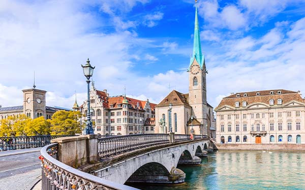 Zurich, Switzerland. View of the historic city center with famous Fraumunster Church, on the Limmat river