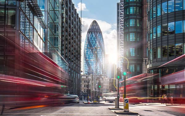 Buses on the street at the financial district of London.