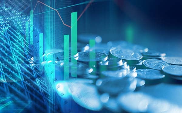 Pile of coins on technology financial graph background with building superimposed