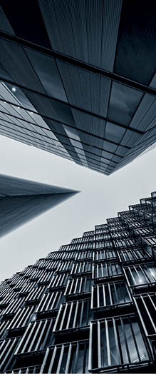 Highly detailed abstract wide angle view up towards the sky in the financial district of London City and its ultra modern contemporary buildings with unique architecture. Shot on Canon EOS R full frame with 10mm wide angle lens. Image is ideal for background. Toned image.